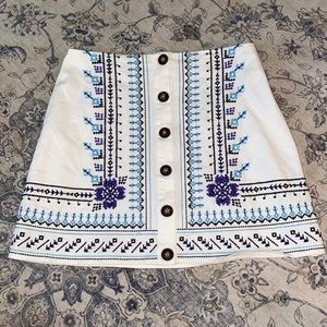 White With Blue Threaded Details